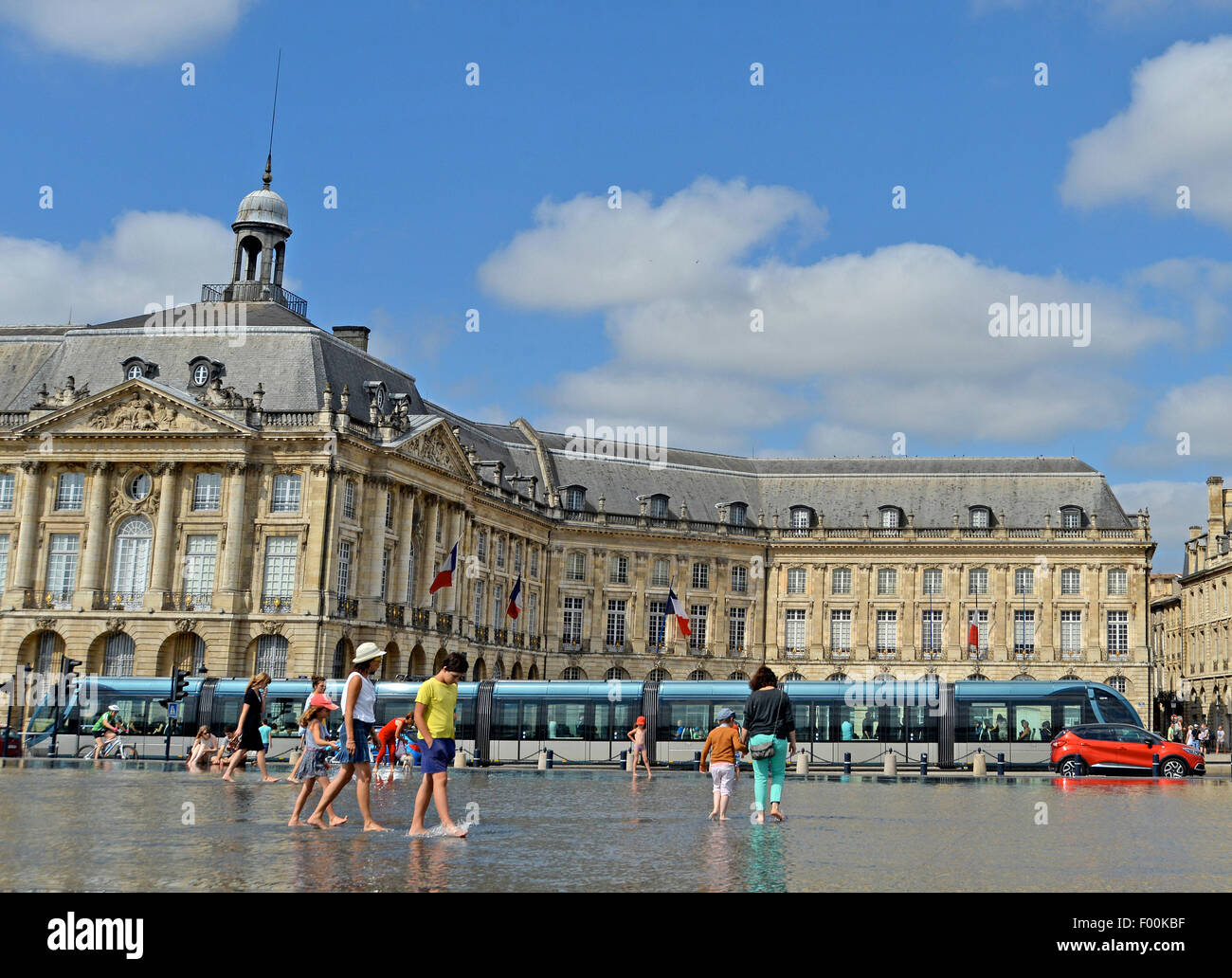 Tram before the water mirror Bourse square Bordeaux Gironde Aquitaine France Stock Photo