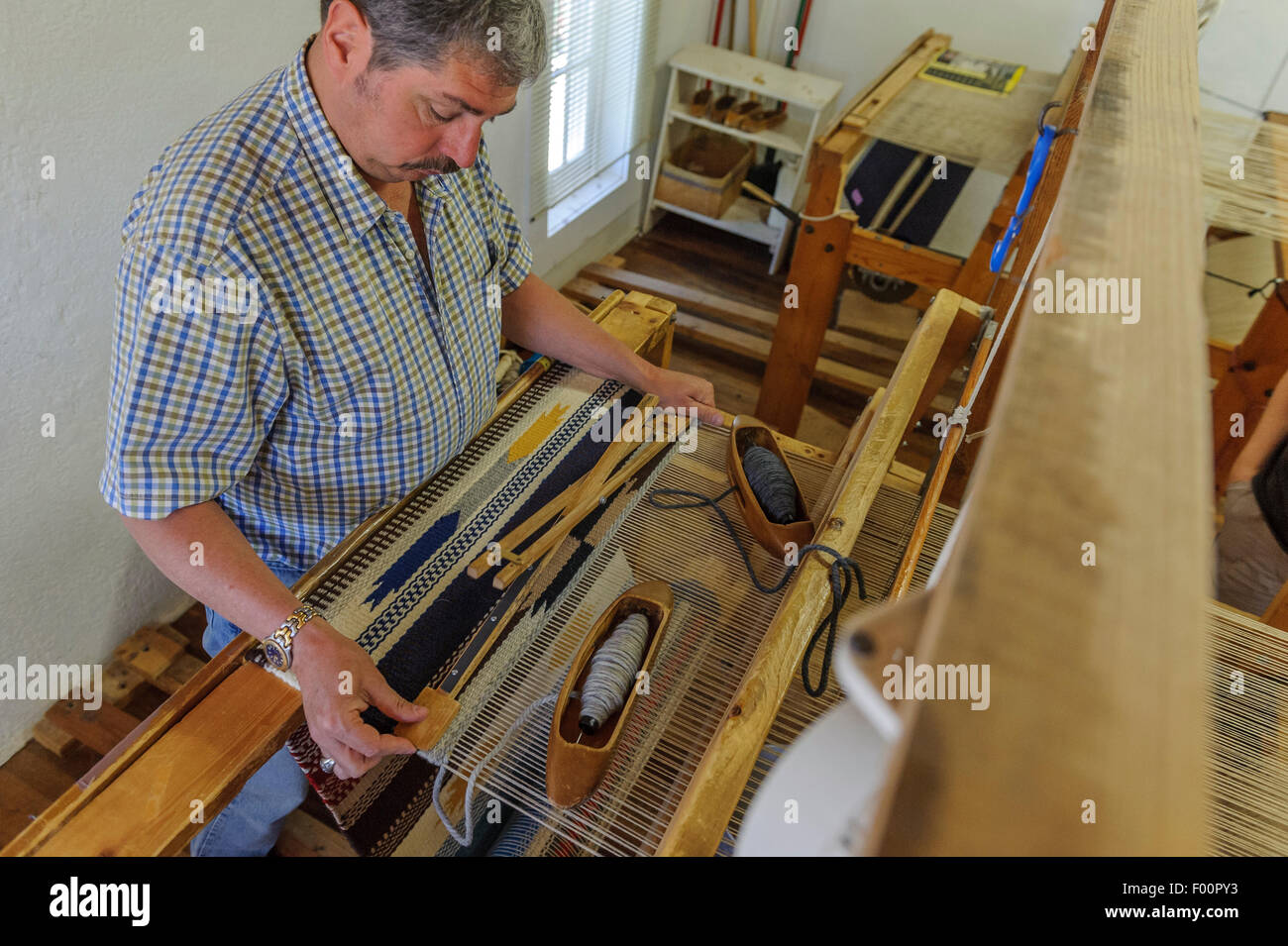 Ortega’s Weaving Shop – Loom Demonstration. Chimayo. New Mexico. USA Stock Photo