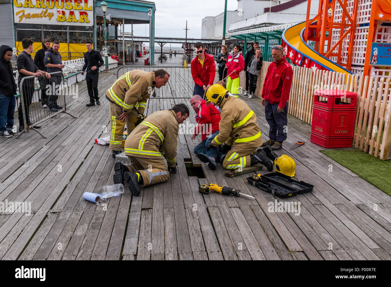 Blackpool, UK. 4th August, 2015. Man gets stuck on North Pier, Blackpool after his foot goes through floor, cut free by Fire Brigade. Credit:  Ian Walker/Alamy Live News Stock Photo
