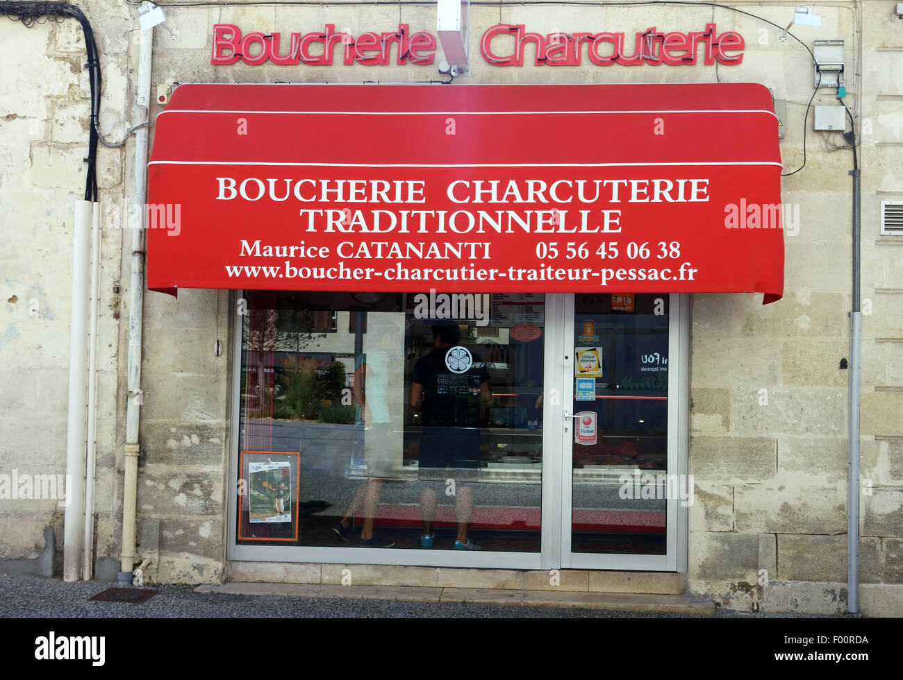 Traditional butcher's shop and charcuterie in small town in France Stock Photo