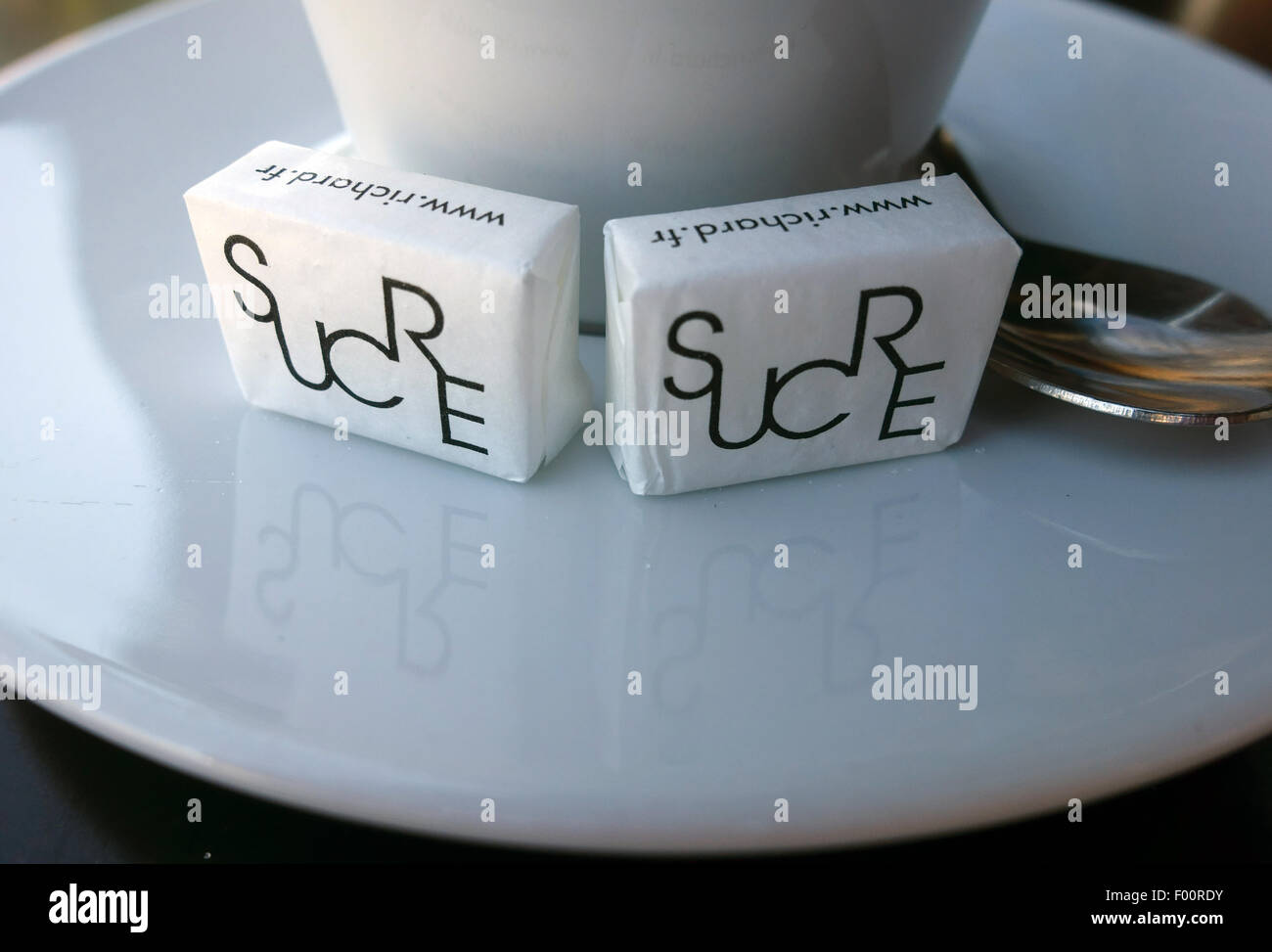 Sugar cubes on coffee cup saucer in French cafe, France Stock Photo Alamy