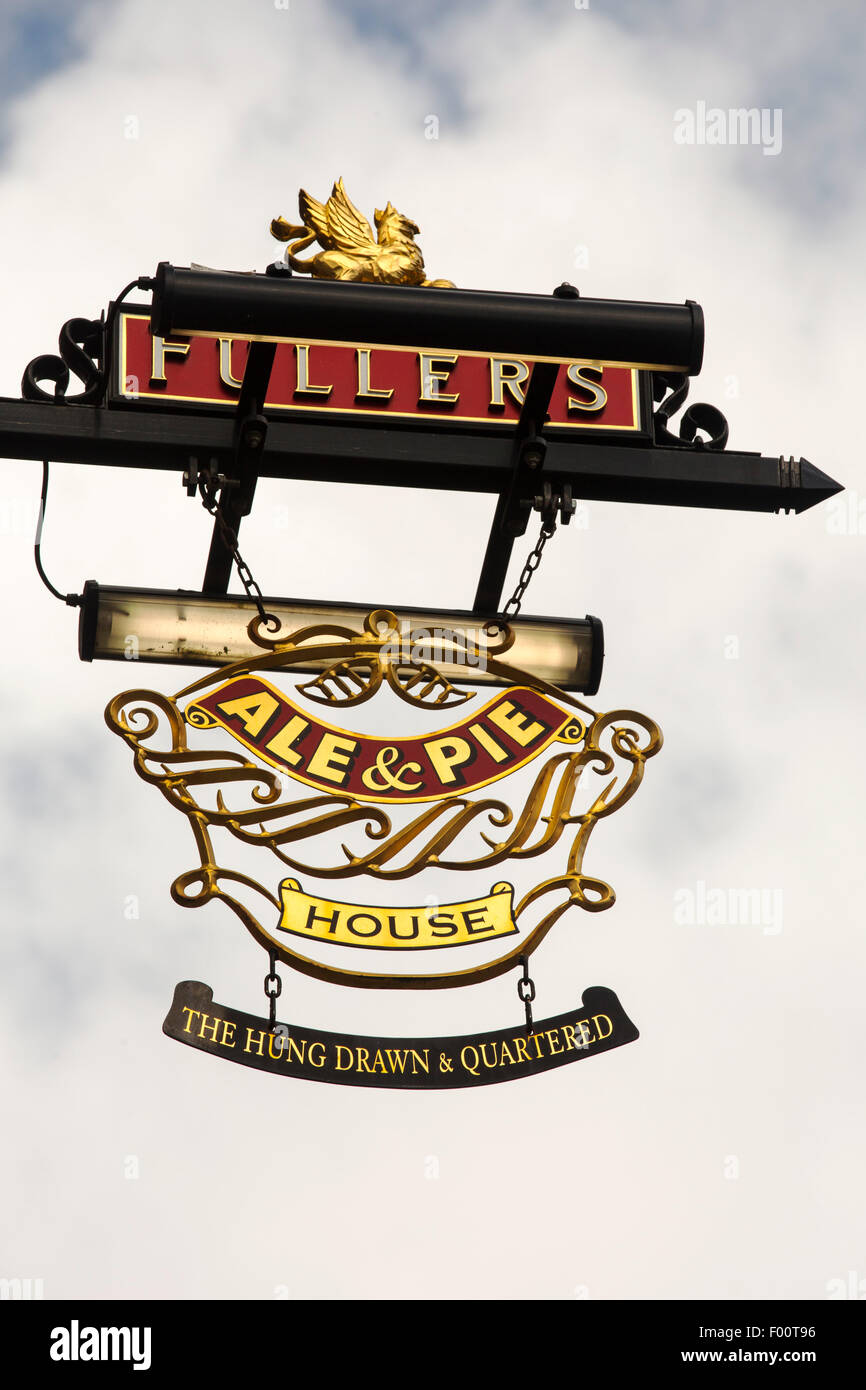 A sign for the Hung Drawn and Quartered pub in the city of London, UK