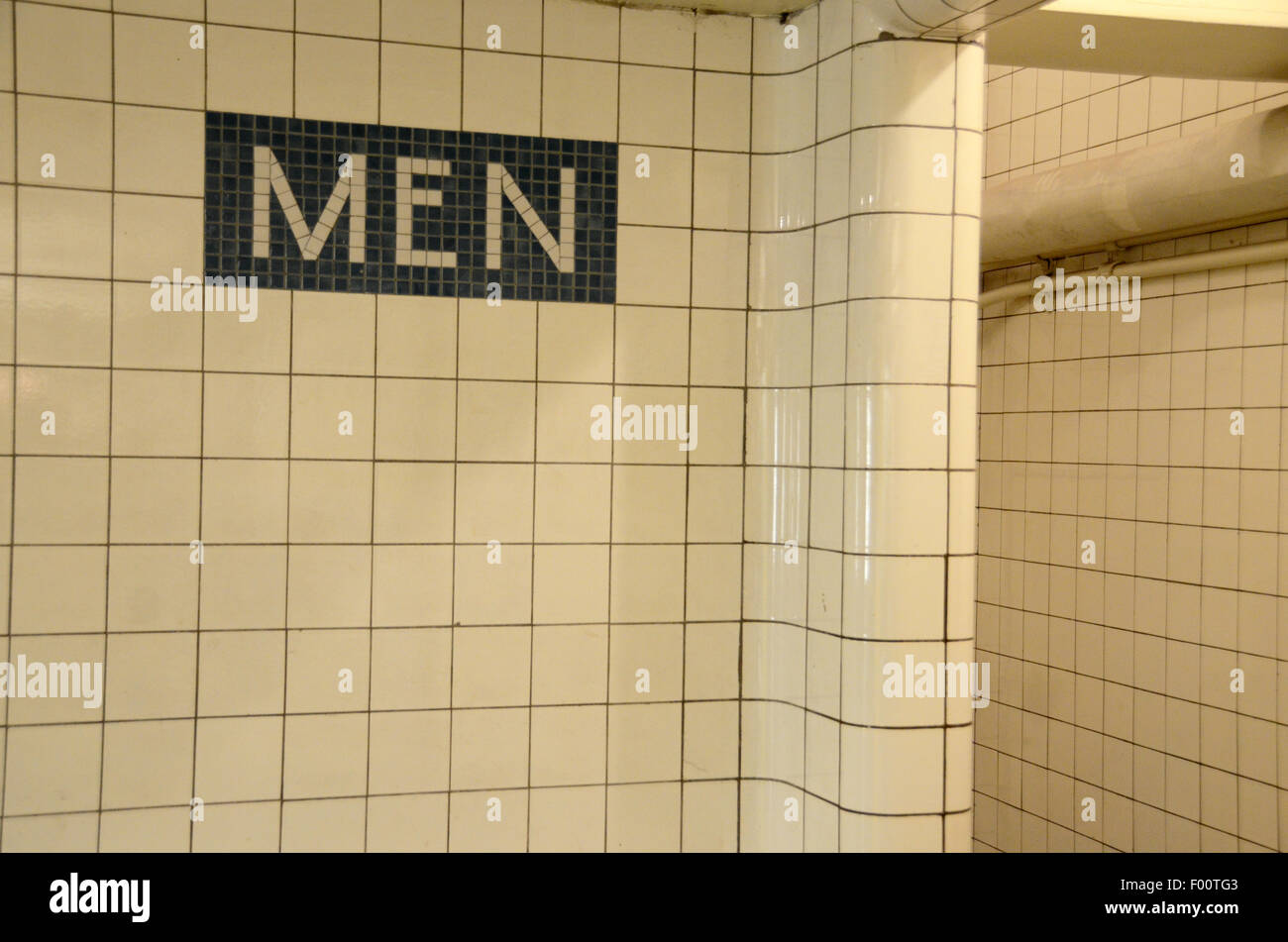 New York Transit Museum men mens toilet sign tiling vintage blue white Stock Photo