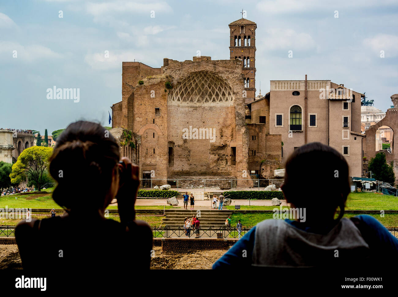 Tourists photographing The Temple of Venus and Rome  from the Colosseum. Rome, Italy. Stock Photo