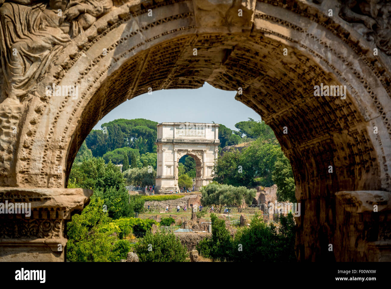 Arch of Titus shot through Arch of Septimius Severus.Roman Forum. Rome,Italy Stock Photo