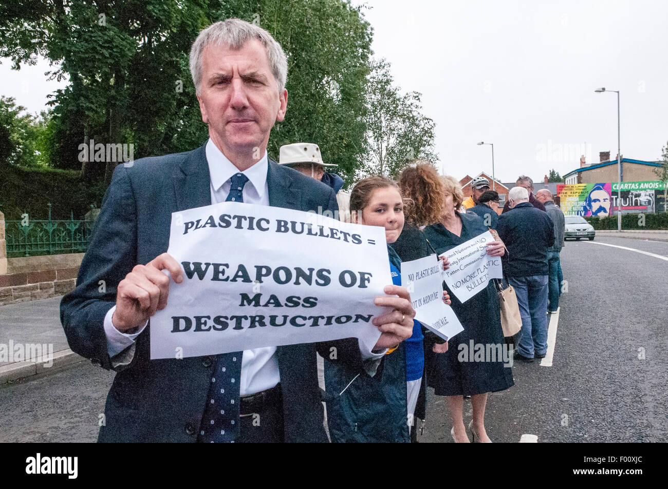 Belfast, Northern Ireland. 5th Aug, 2015. Sinn Fein councillor Mairtin O Muilleoir takes part in a 'White Line Protest' against the use of plastic bullets in Palestine by the Israeli security forces.  [Note to editors: A white line protest is when many people stand in the middle of the road with posters for a political cause, and have been used by republicans since the start of the troubles. Credit:  Stephen Barnes/Alamy Live News Stock Photo