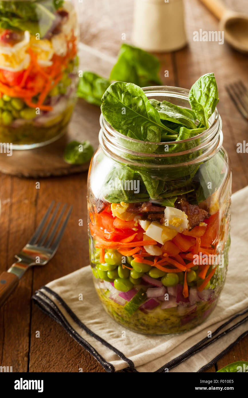 Healthy Homemade Mason Jar Salad with Egg Bacon Lettuce and Veggies