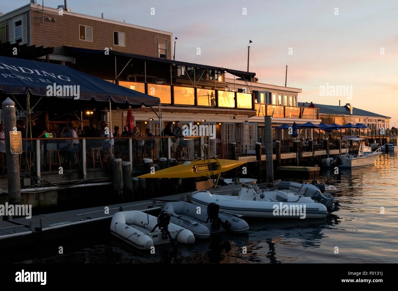 Bowen's wharf, people sit at bar and eating meal at Landings Restaurant