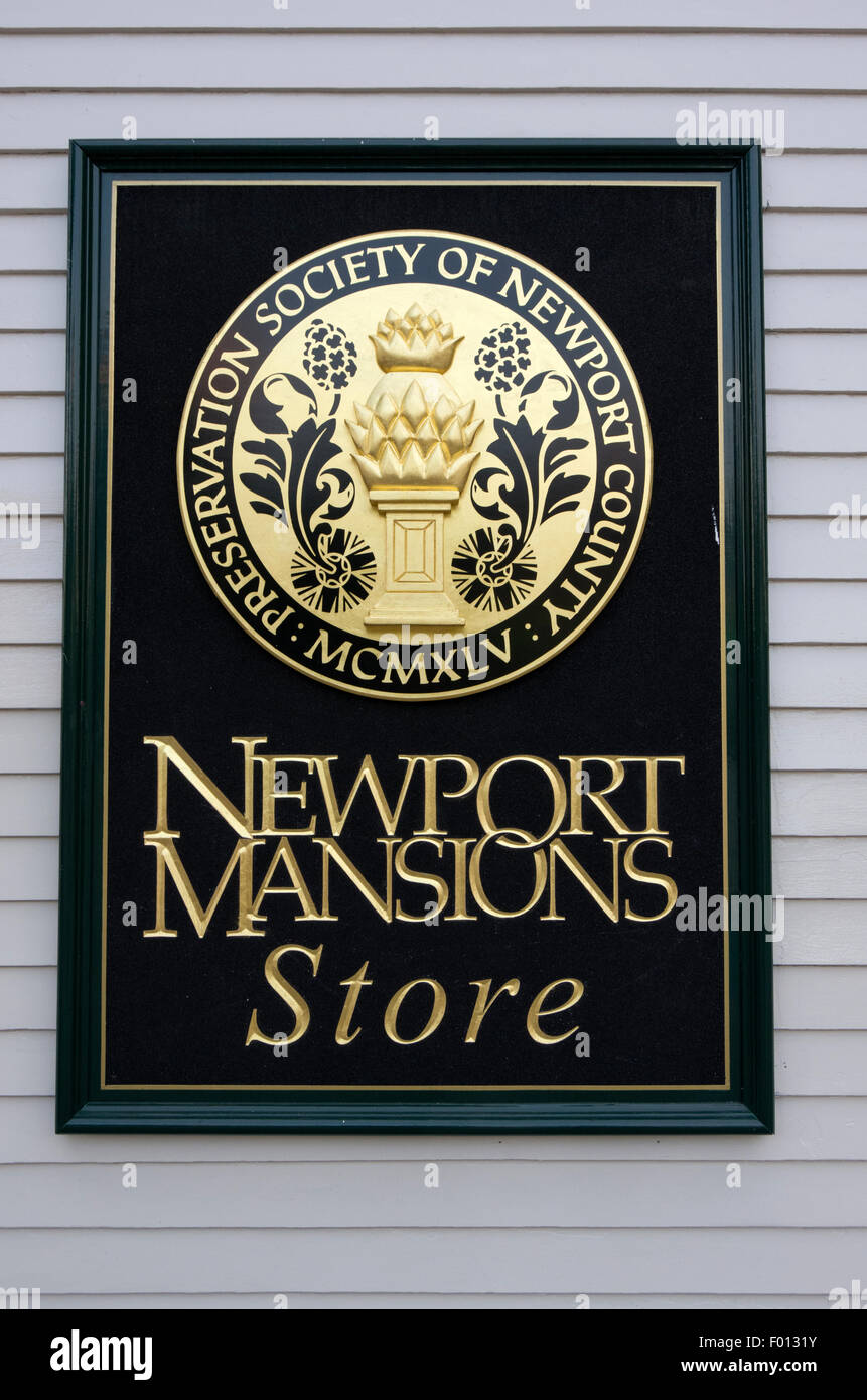 Newport Mansions store sign on side of clapboad building on wharf Stock