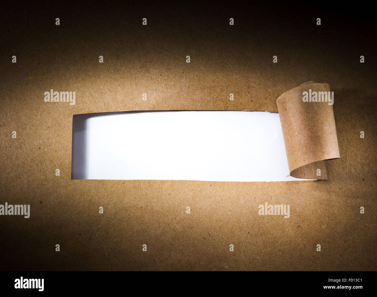 Torn brown paper with blank white space. Stock Photo