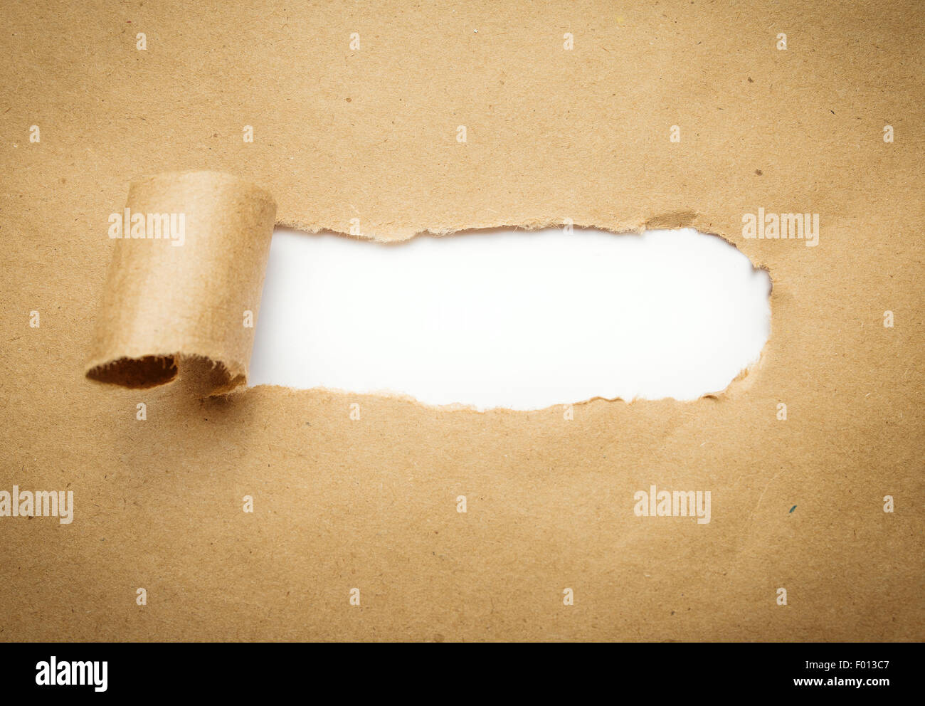 Torn brown paper with blank white space. Stock Photo