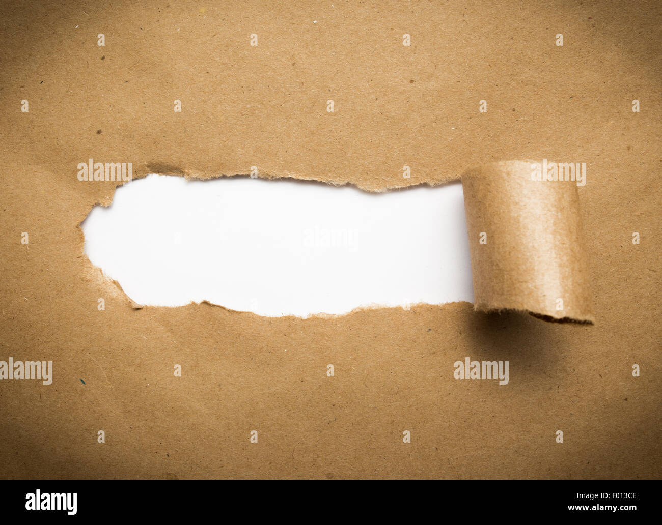 Torn brown paper with blank white space. Stock Photo