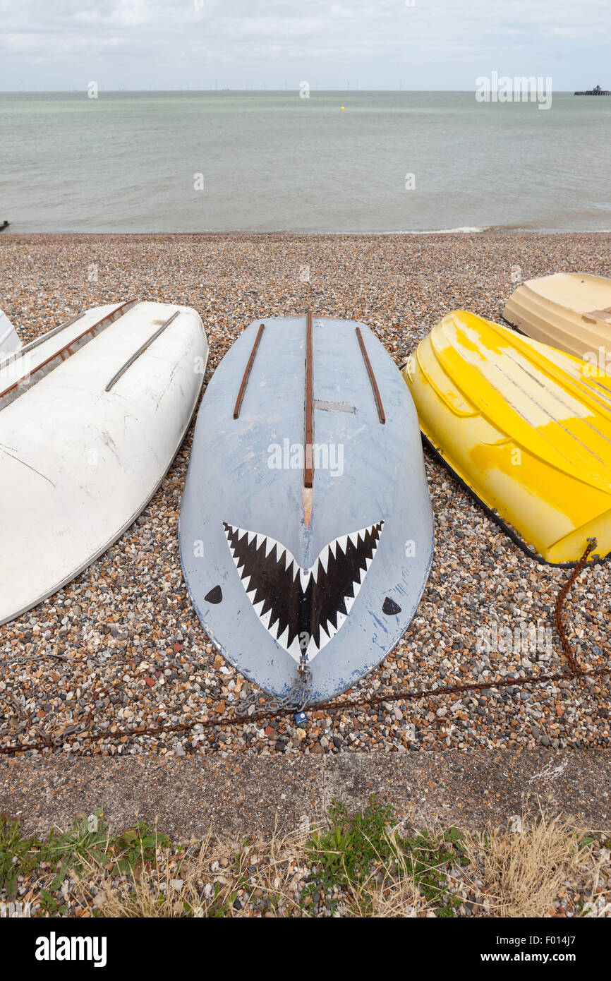 Upturned boat decorated as a shark Stock Photo