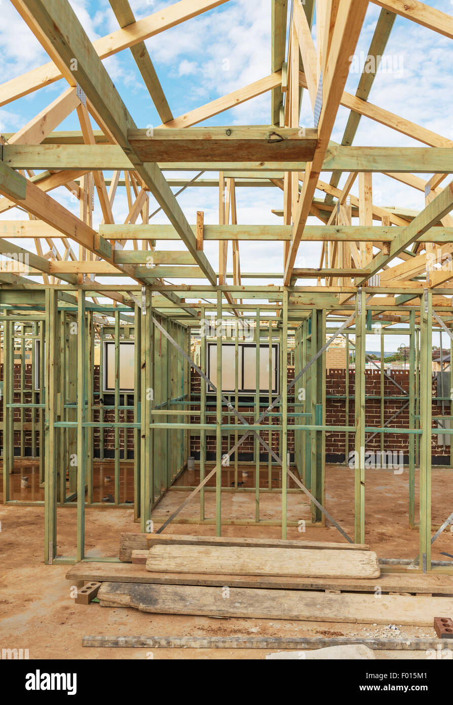 New residential construction home framing against a blue sky. Stock Photo