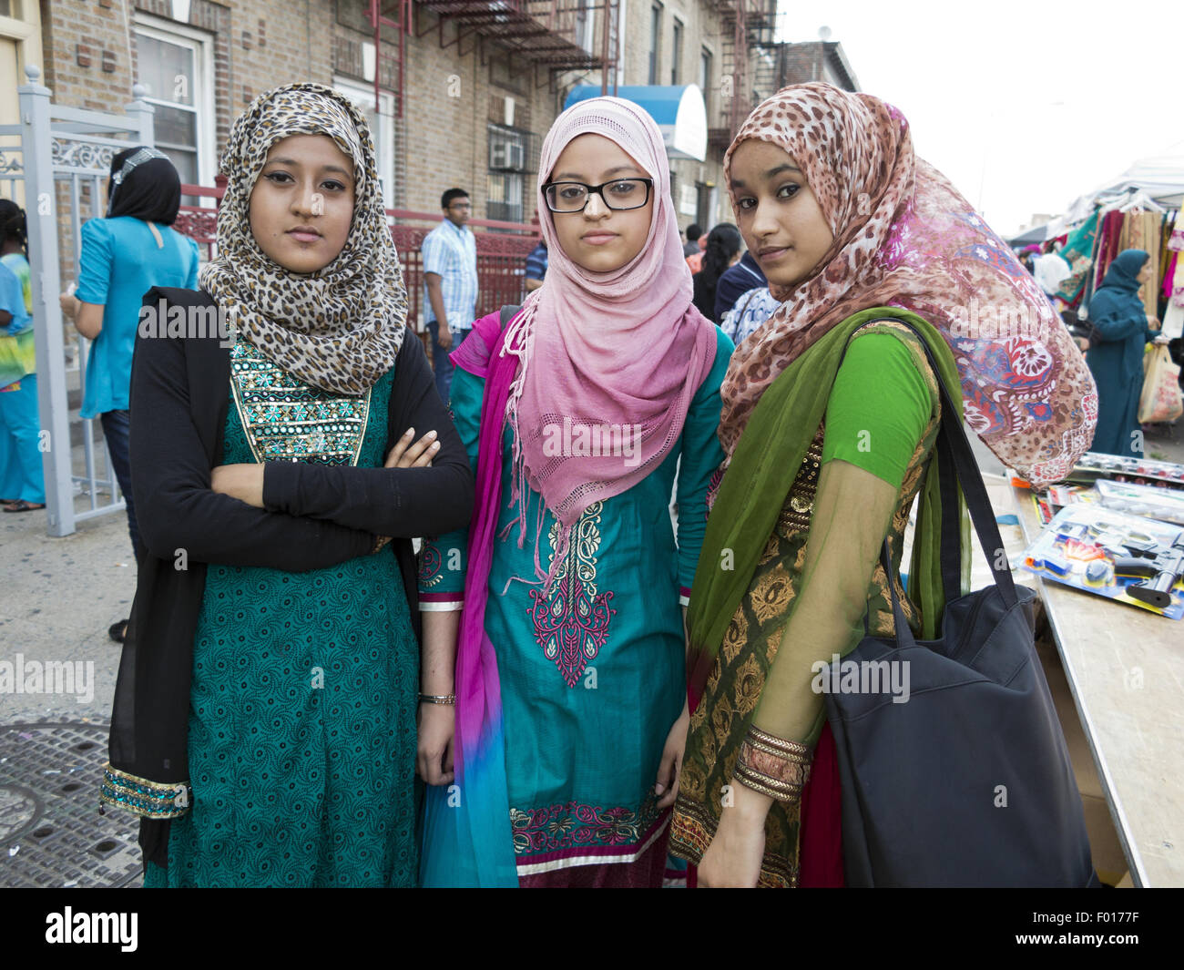 Teenage, Bangladeshi-American girlfriends enjoy street fair and festival in 'Little Bangladesh,' in Brooklyn, NY. Stock Photo