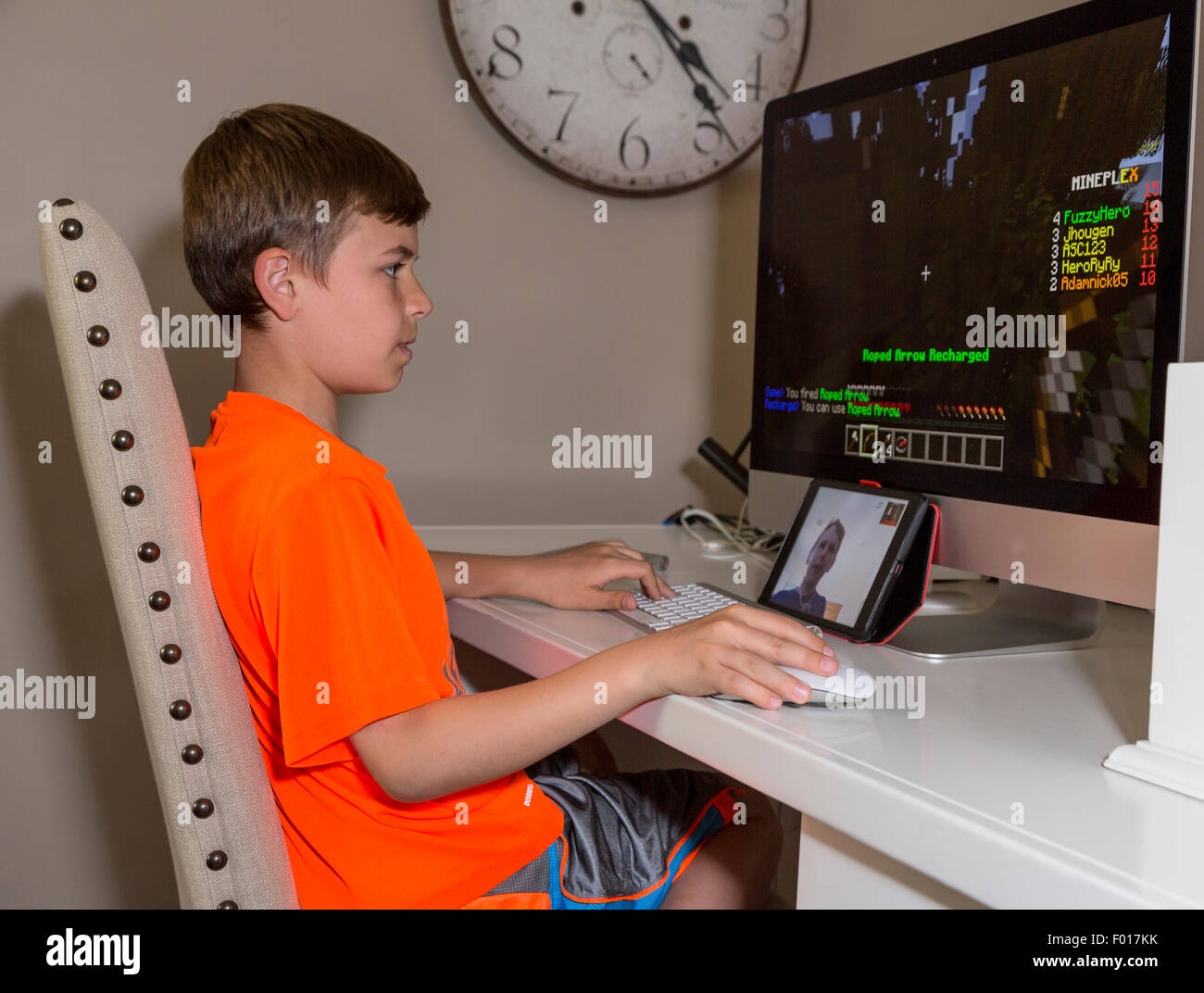 Two Young Boys Play Video Games at Long Distance, Communicating via Facetime. MR Stock Photo Alamy