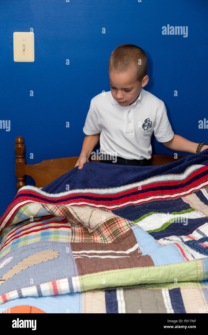 Boy making bed hires stock photography and images Alamy