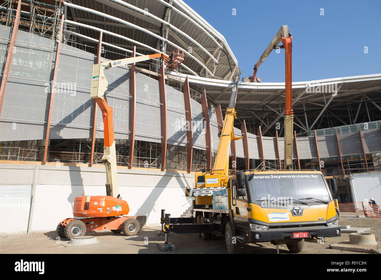 (150806) -- RIO DE JANEIRO, Aug. 6, 2015 (Xinhua) -- Construction machineries are seen outside the future Carioca Arenas at Barra Olympic Park for Rio 2016 Olympic Games in Rio de Janeiro, Brazil. According to the statistic provided by Rio de Janeiro Municipality government, the Olympic Park in Barra da Tijuca area, which will witness the majority of the Olympic competitions, is 82 percent ready. Edwardo Paes, mayor of the city of Rio de Janeiro told a press conference on Wednesday that all the venues will be deliverd in time for the competition next year, 'We are making a miracle happen here, Stock Photo