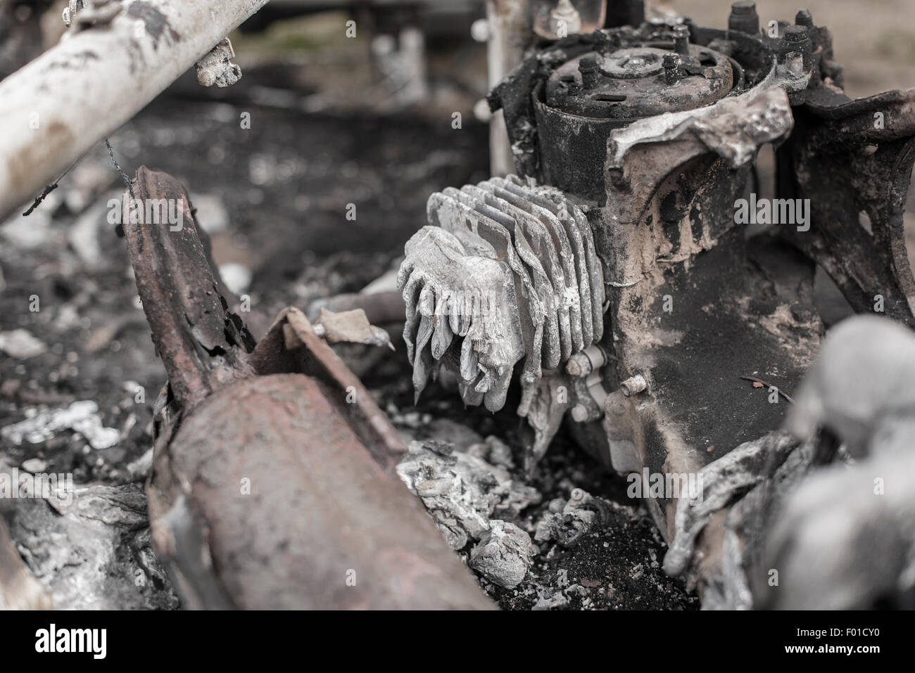 The burnt aftermath of a scooter fire Stock Photo