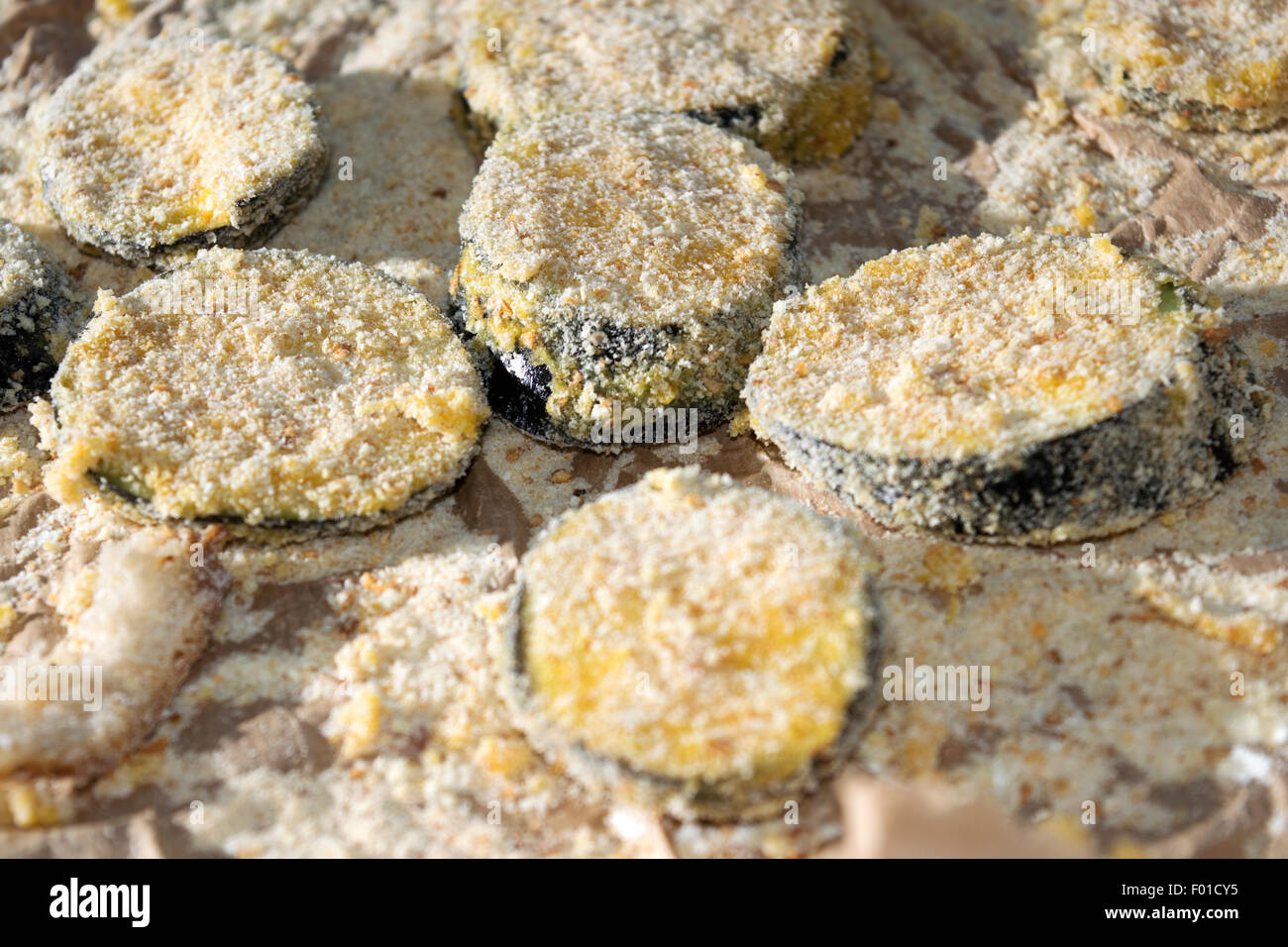slices of breaded eggplants ready to be fried Stock Photo Alamy