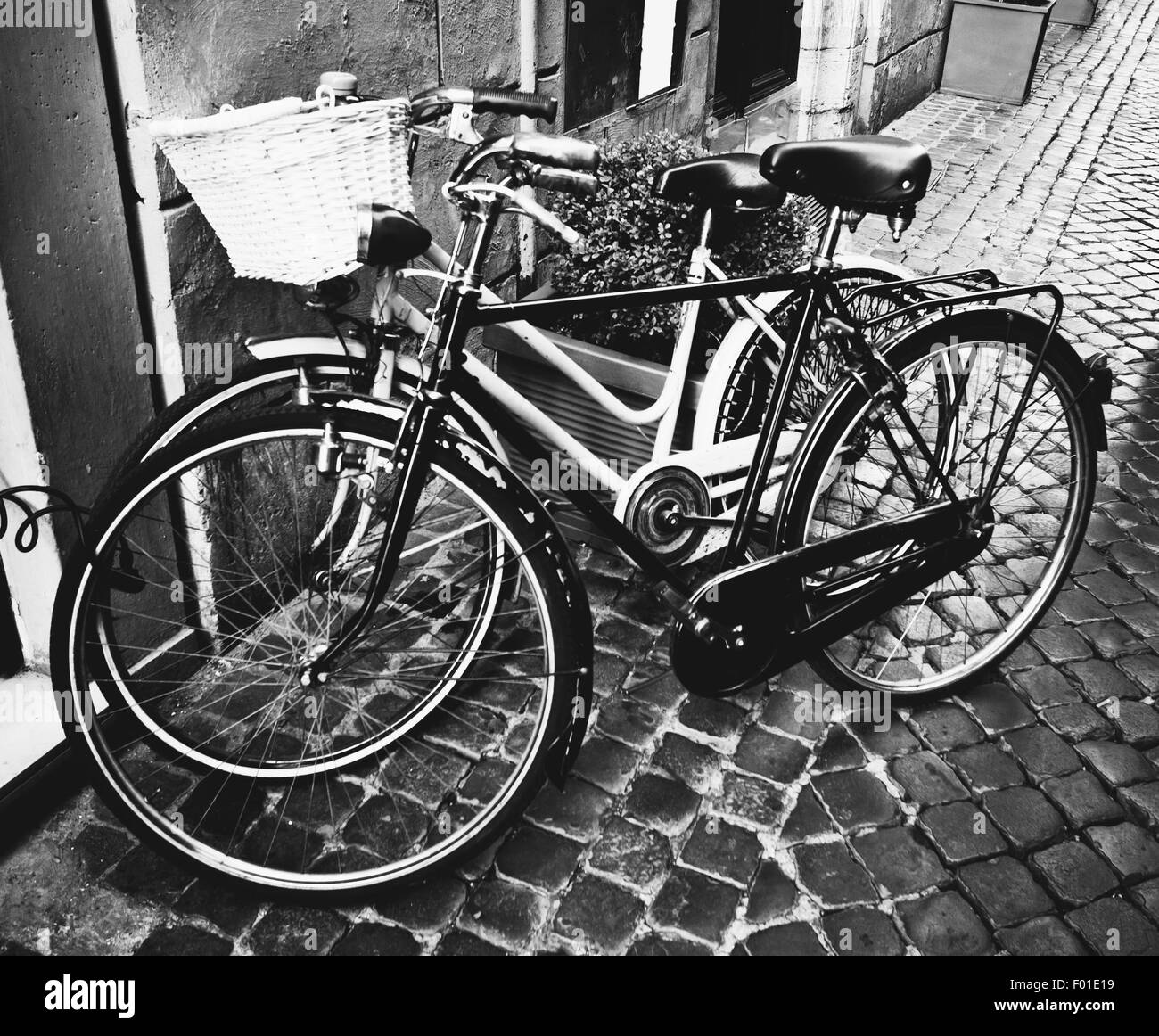 Two classic vintage retro city bicycles, bw photo, Rome, Italy Stock Photo