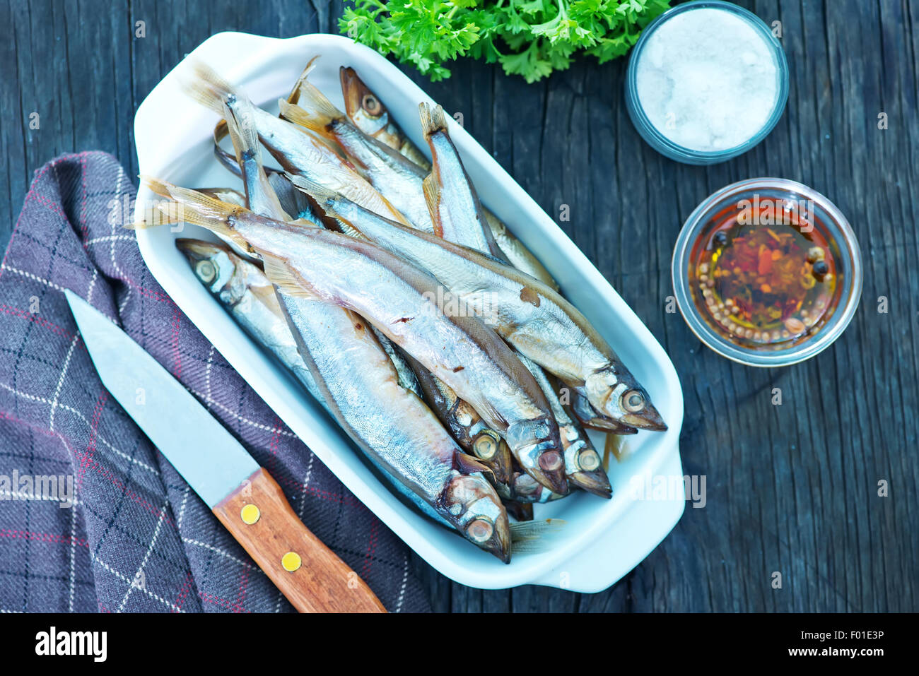 smoked fish with spice on a table Stock Photo