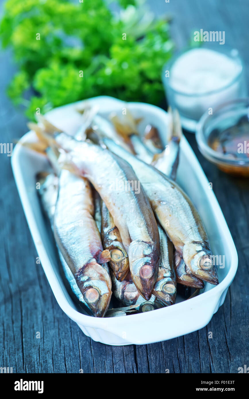 smoked fish with spice on a table Stock Photo