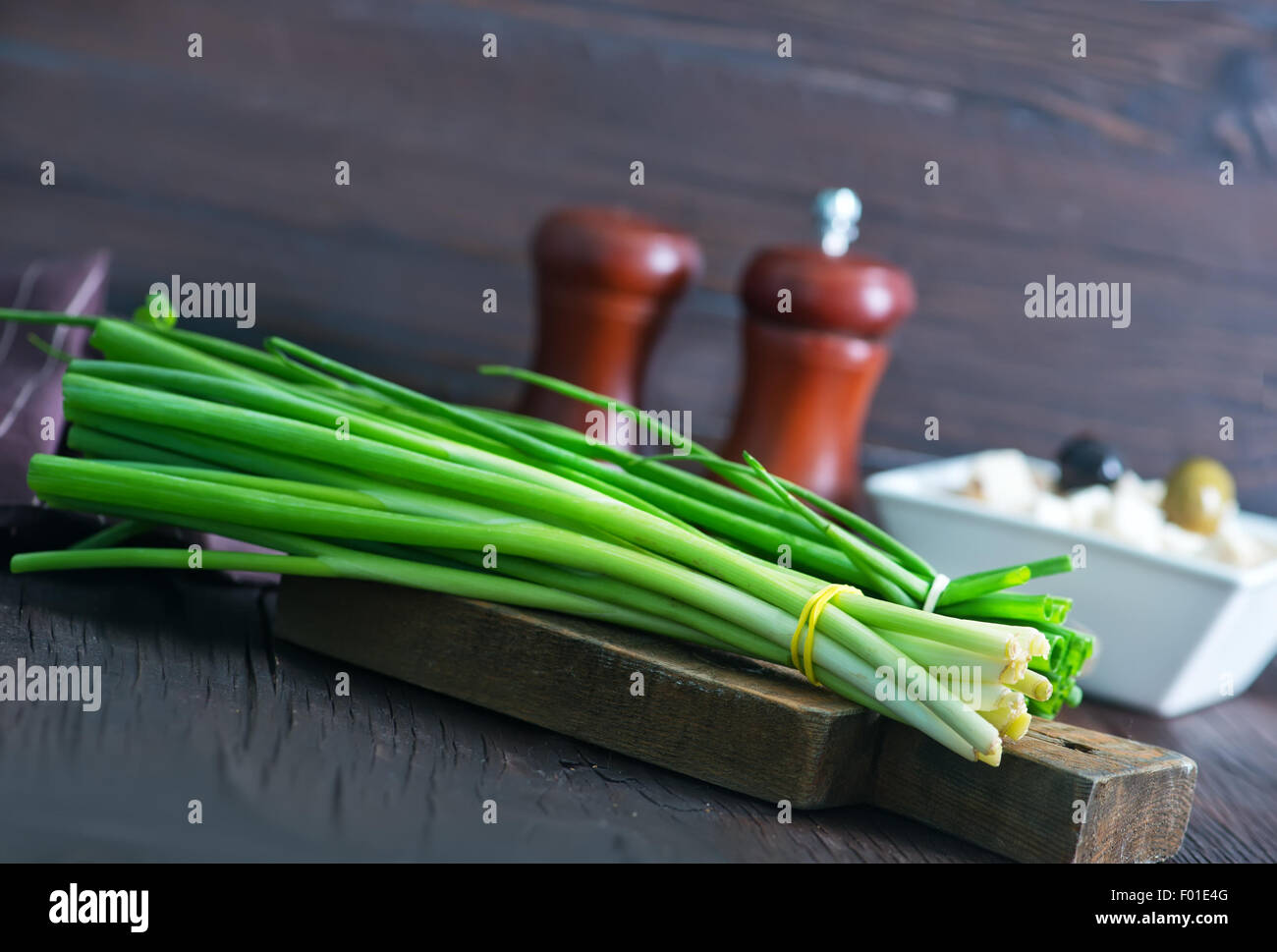 fresh onion on wooden board and on a table Stock Photo - Alamy