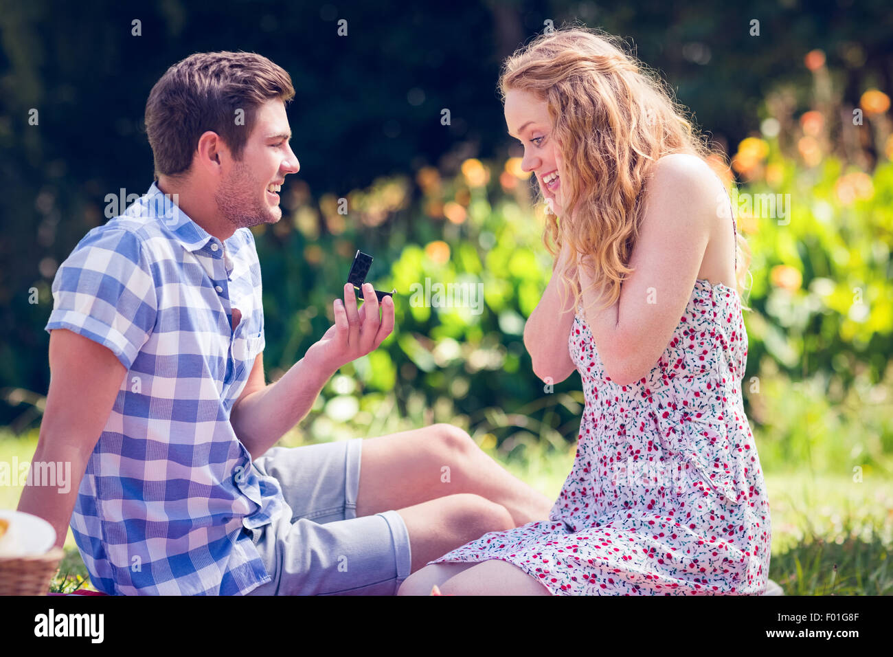 Handsome man doing marriage proposal to his girlfriend Stock Photo
