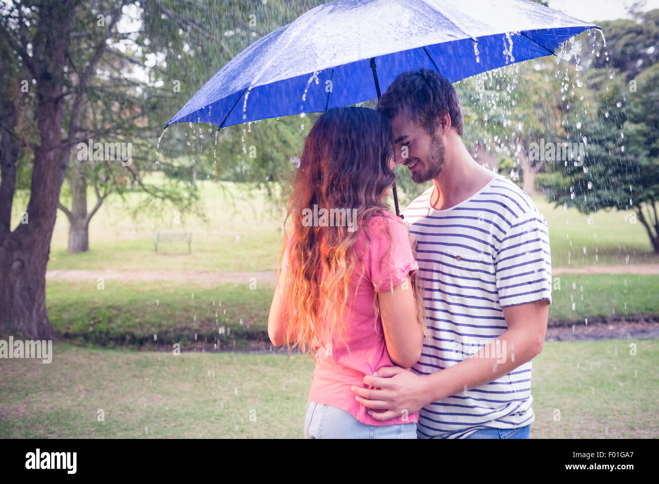 Cute couple hugging under the umbrella Stock Photo Alamy