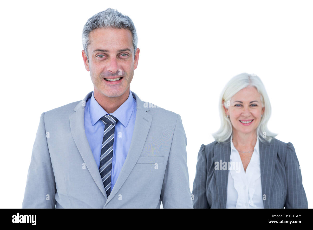 businessman and businesswoman smiling at the camera Stock Photo - Alamy