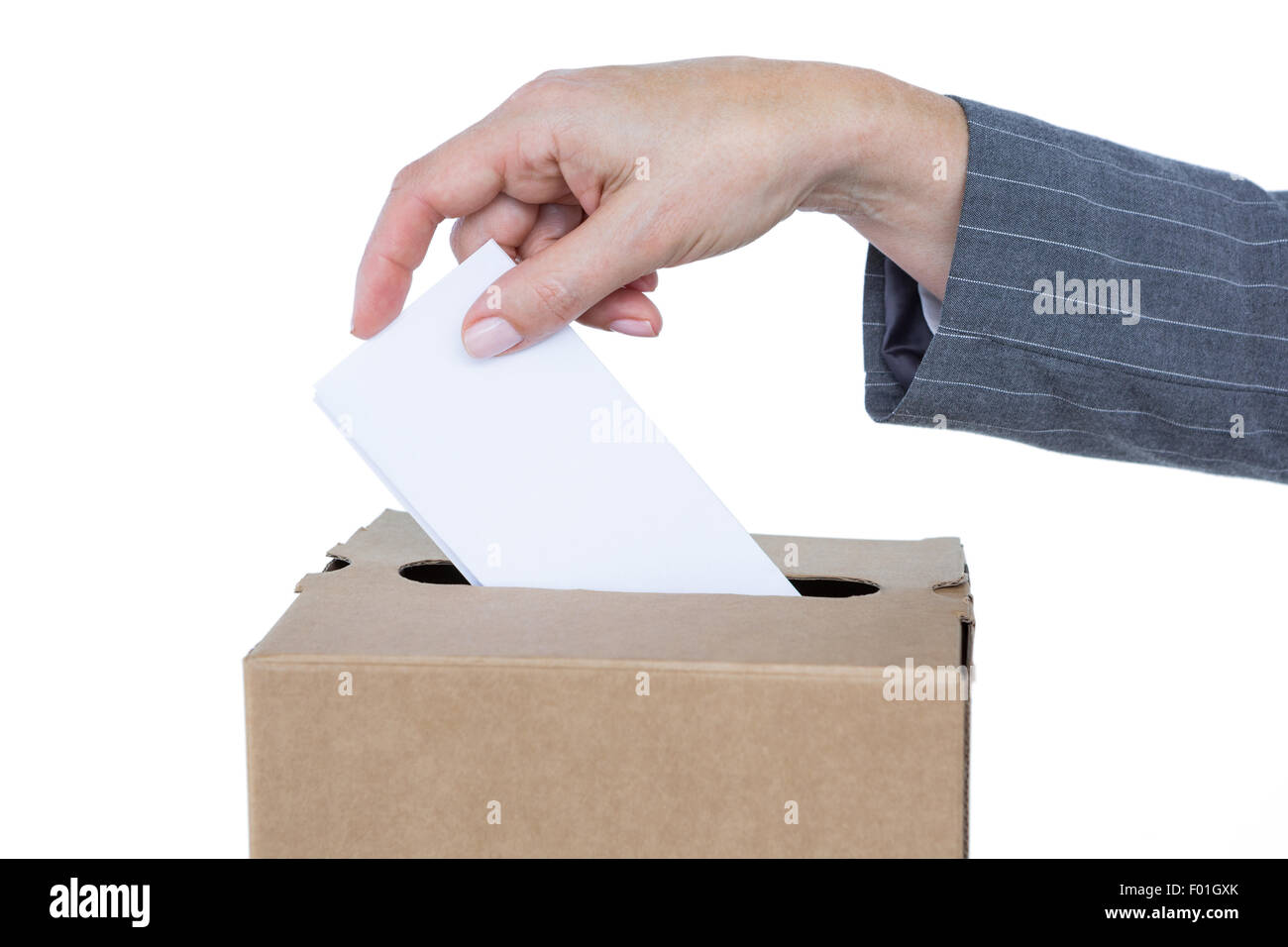 Businessman putting ballot in vote box Stock Photo
