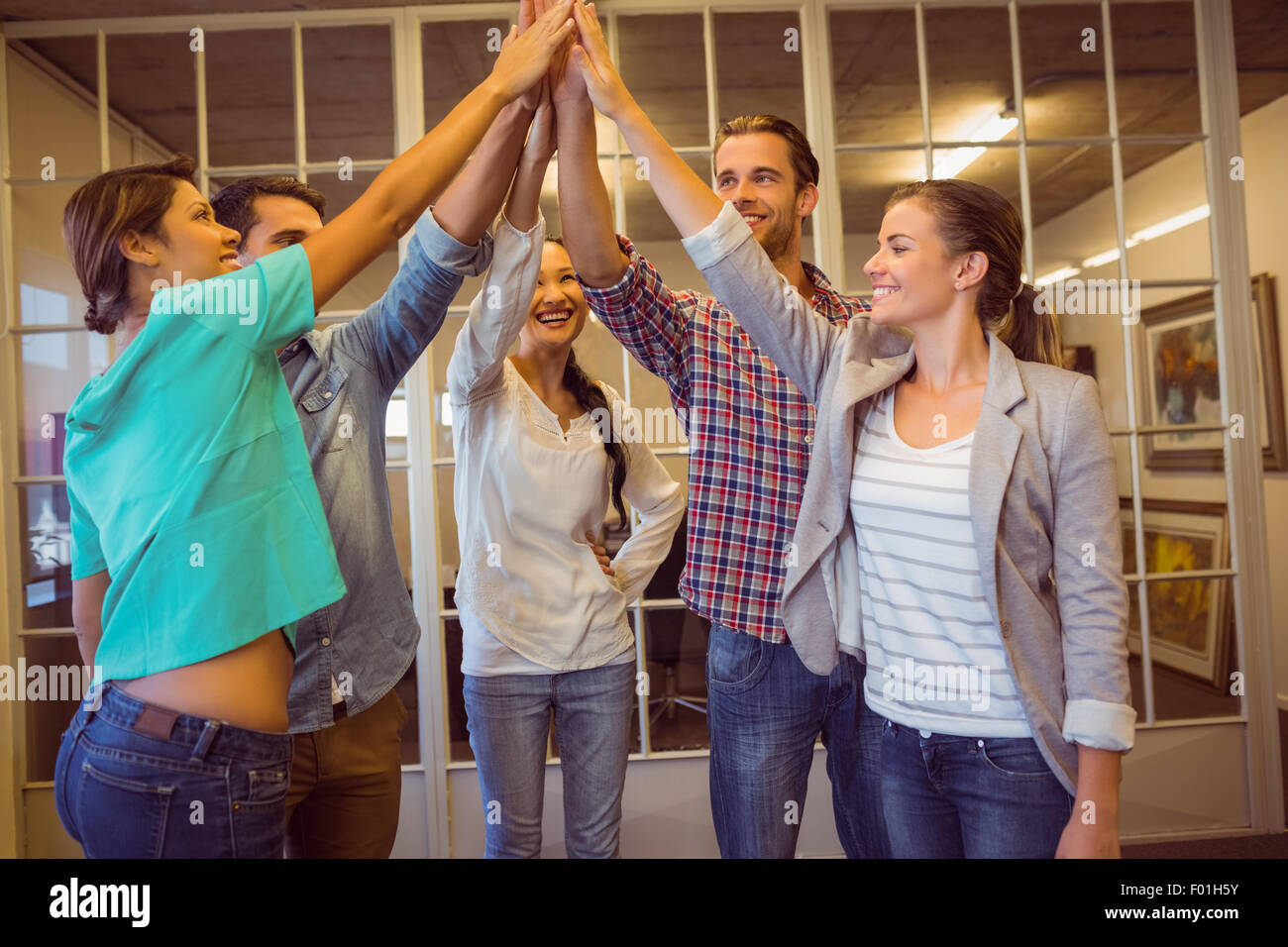 Creative business team waving their hands Stock Photo - Alamy