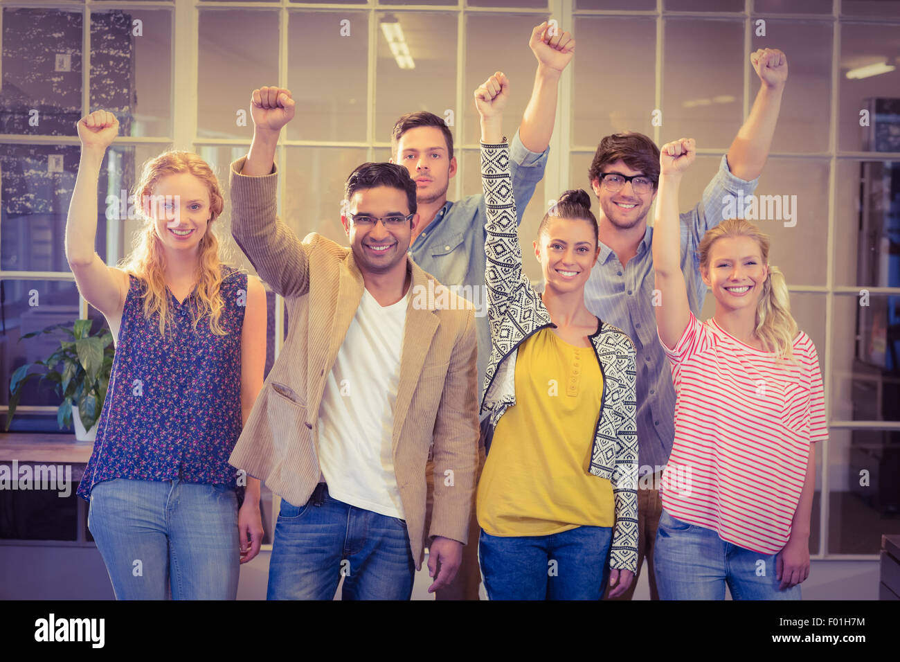 Business people cheering at the camera Stock Photo