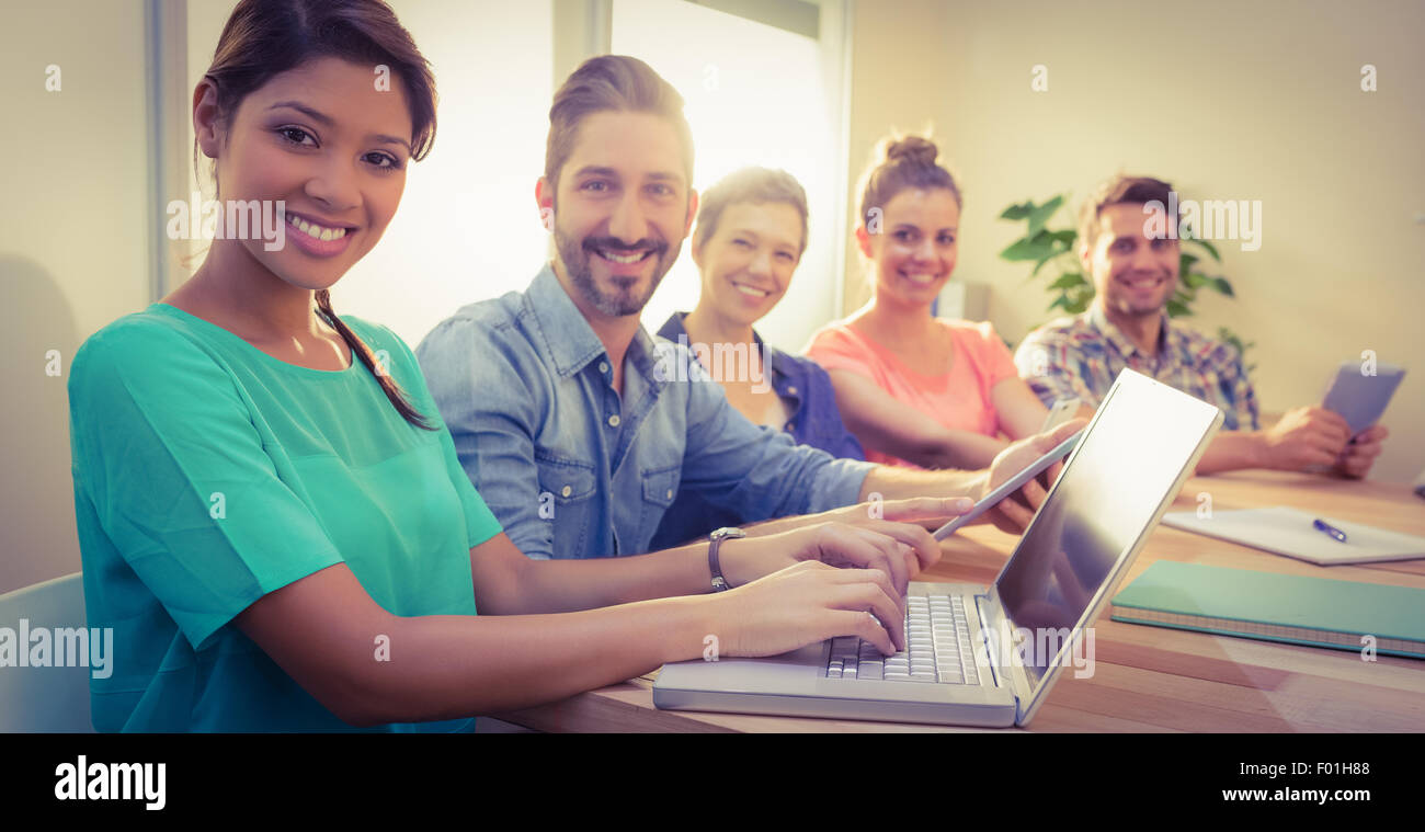Creative business team smiling at camera Stock Photo - Alamy