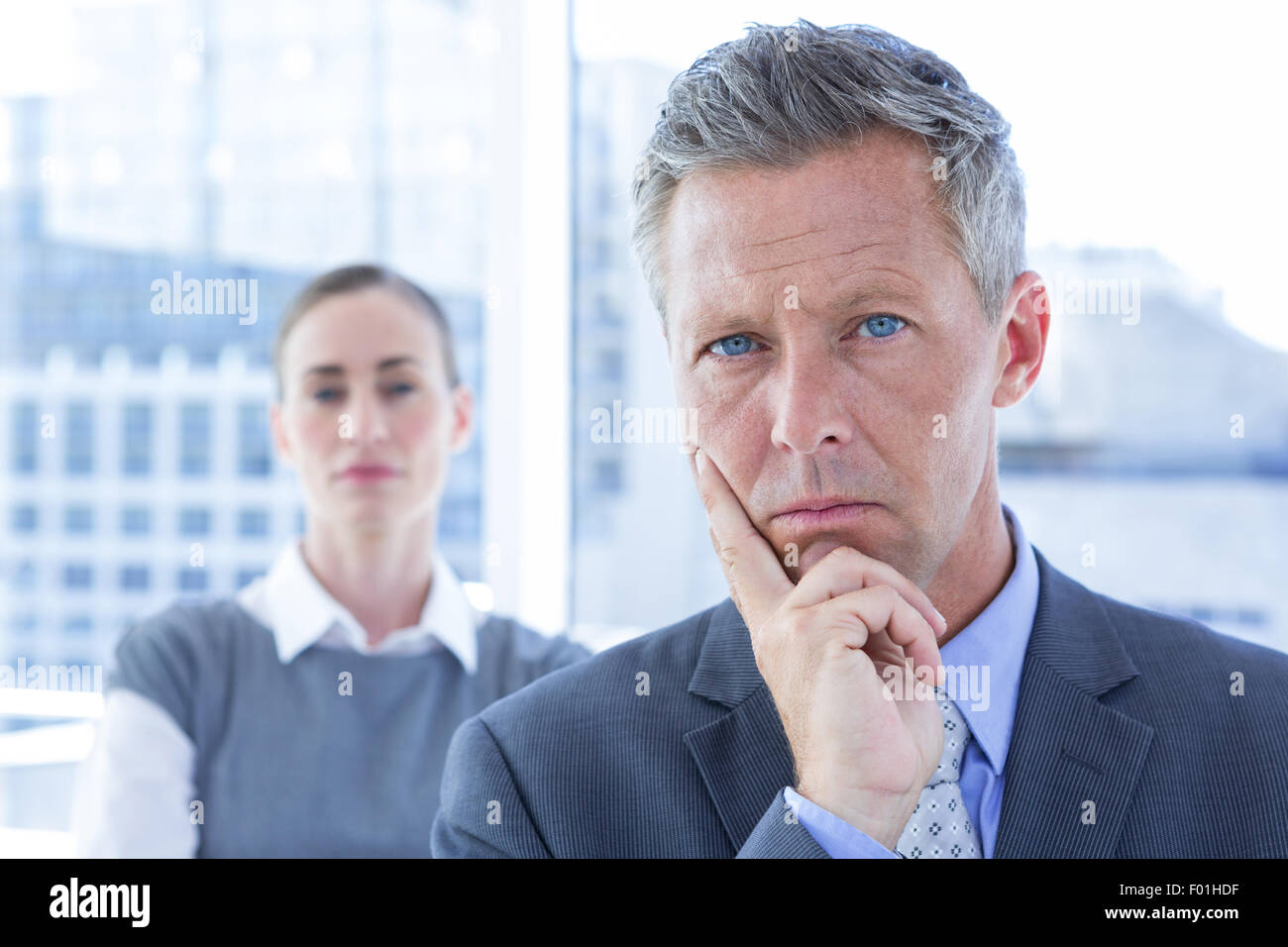 Puzzled businessman in the office Stock Photo