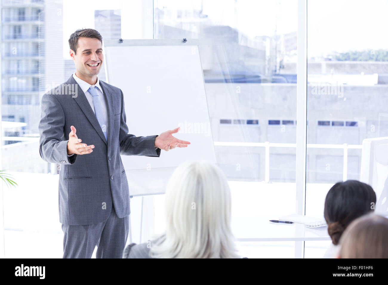 Business team looking at white screen Stock Photo - Alamy