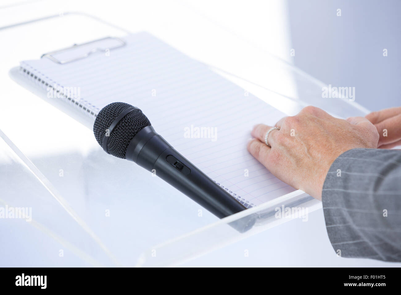 Businessman taking notes at conference Stock Photo