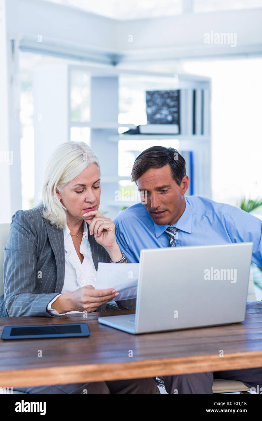 Serious business people working together Stock Photo - Alamy
