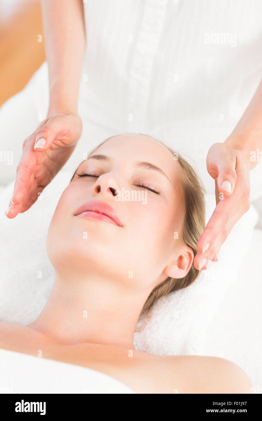 Calm woman receiving reiki treatment Stock Photo - Alamy