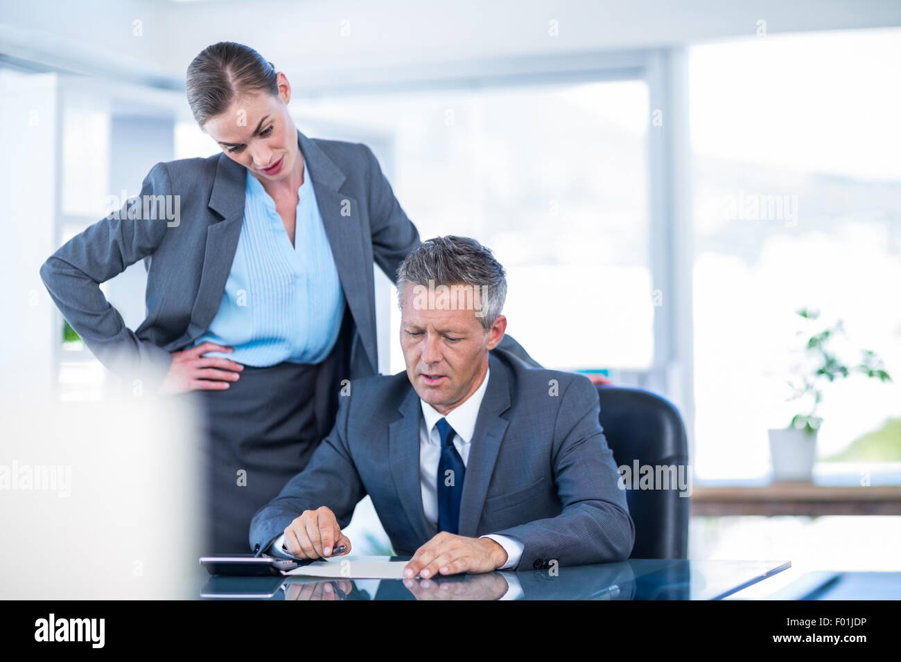 Serious business people working together Stock Photo - Alamy