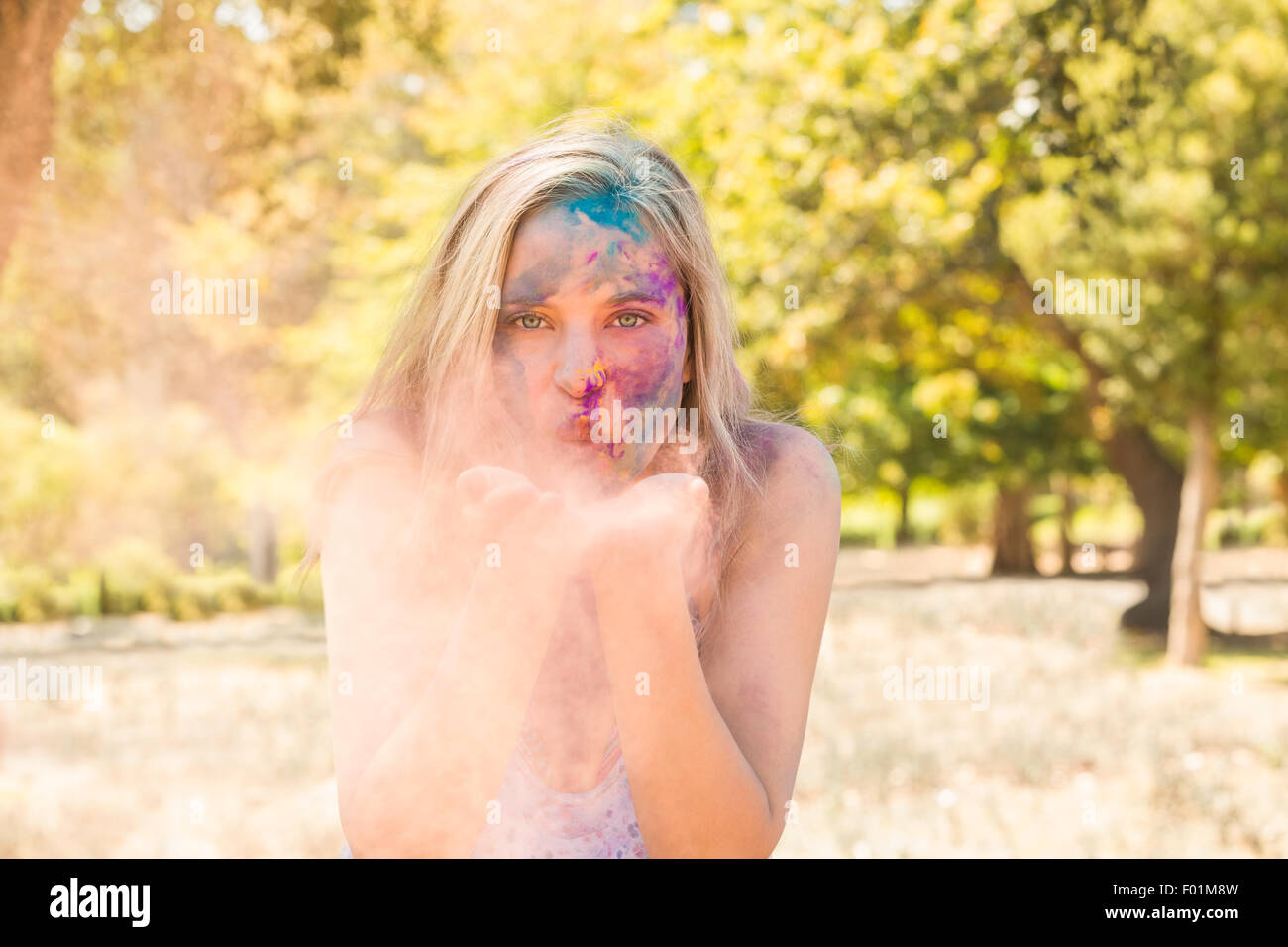 Powder Paint Playing Young woman having fun with powder paint Stock Photo - Alamy