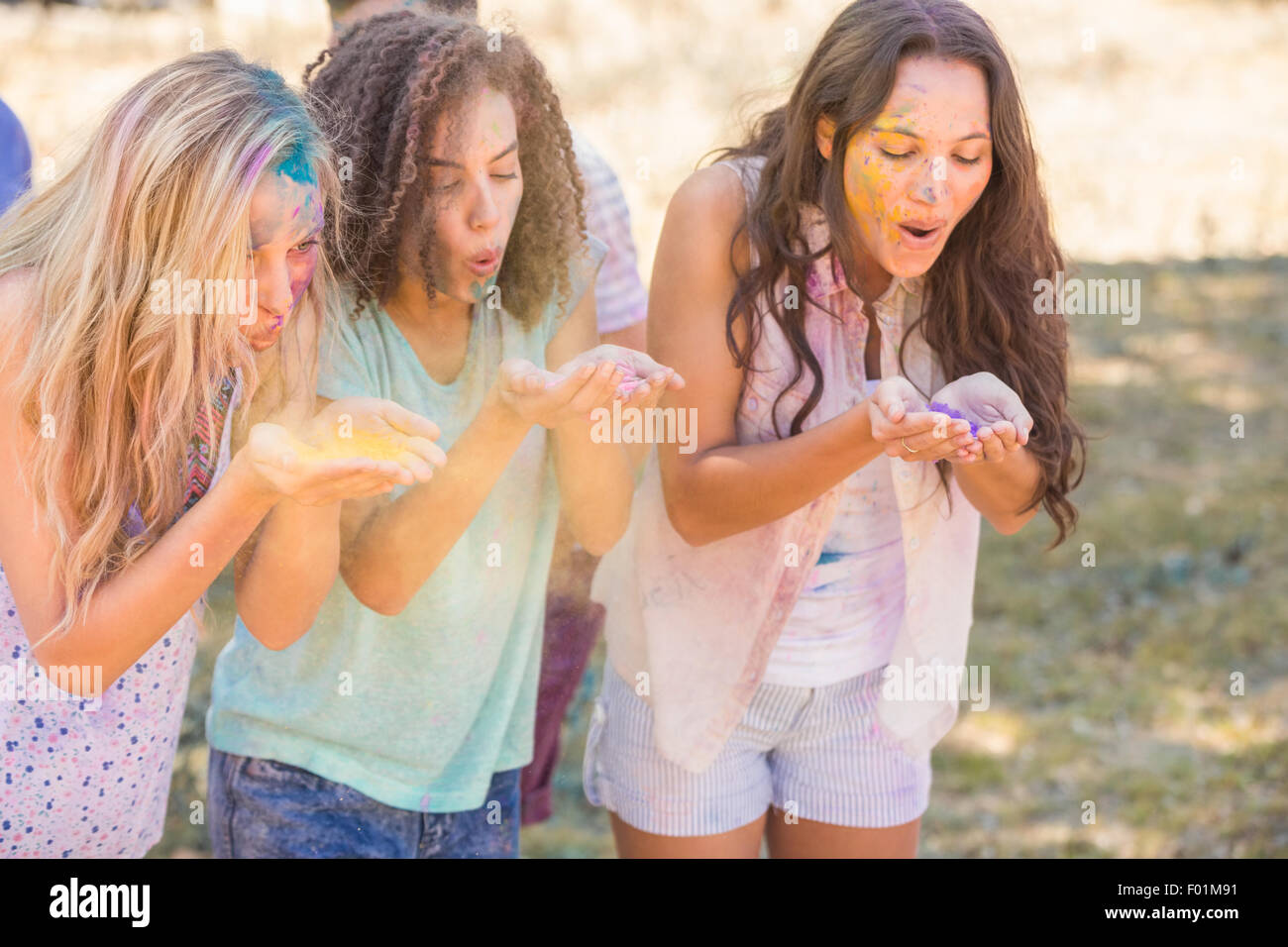 Powder Paint Playing Young women having fun with powder paint Stock Photo - Alamy