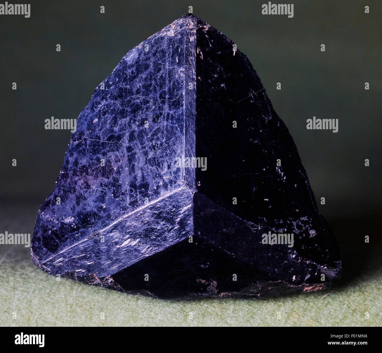 Trigonal dark brown crystal of Tourmaline, silicate. Stock Photo