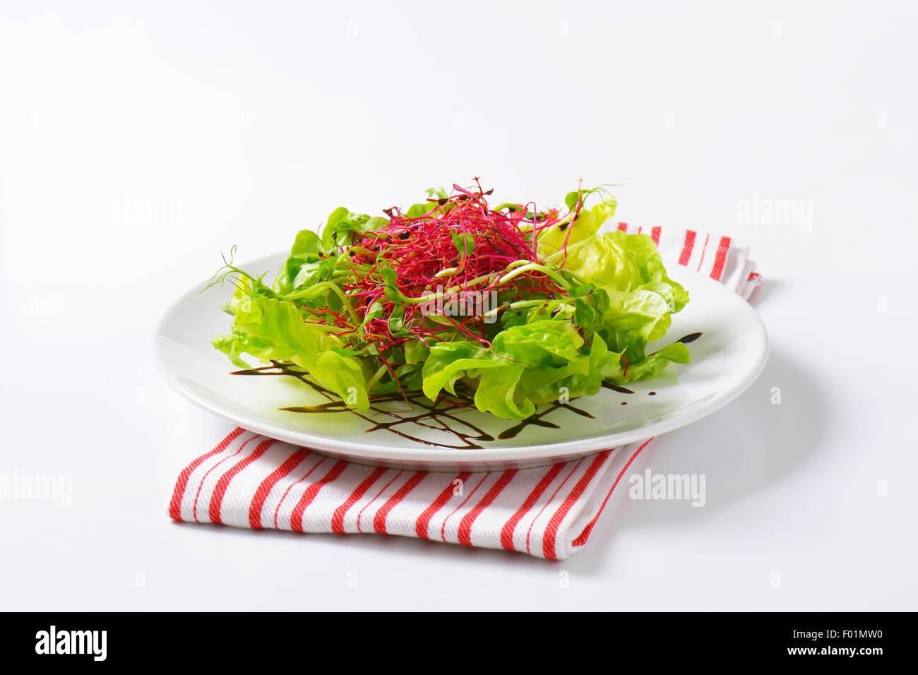Mixed green salad garnished with balsamic vinegar Stock Photo Alamy