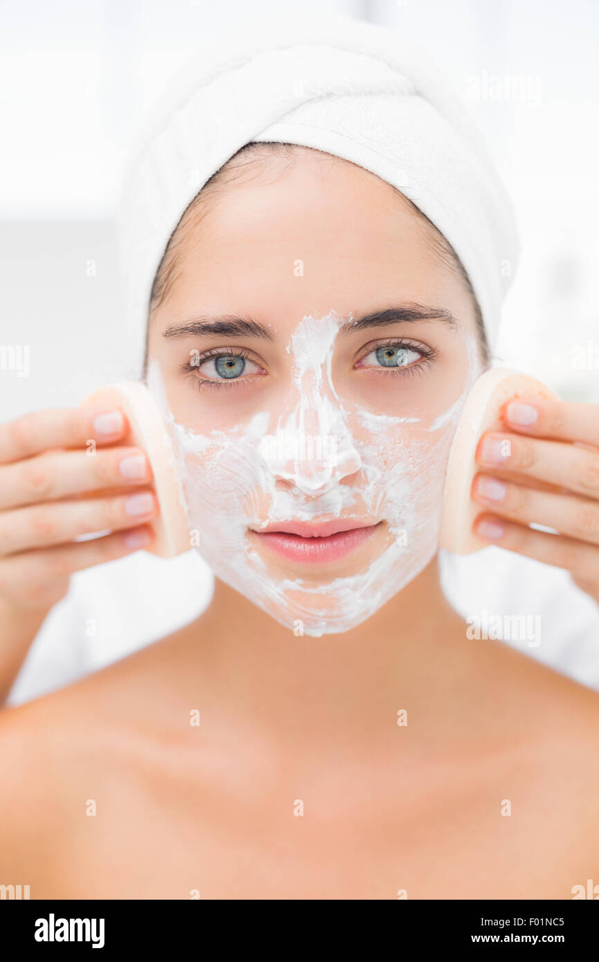 Hands cleaning woman face with sponge Stock Photo Alamy