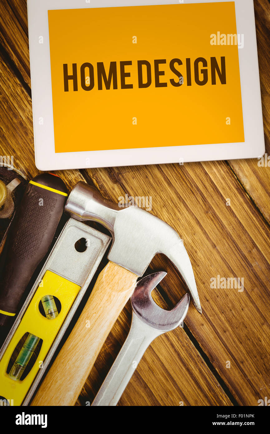 Home design against desk with tools Stock Photo