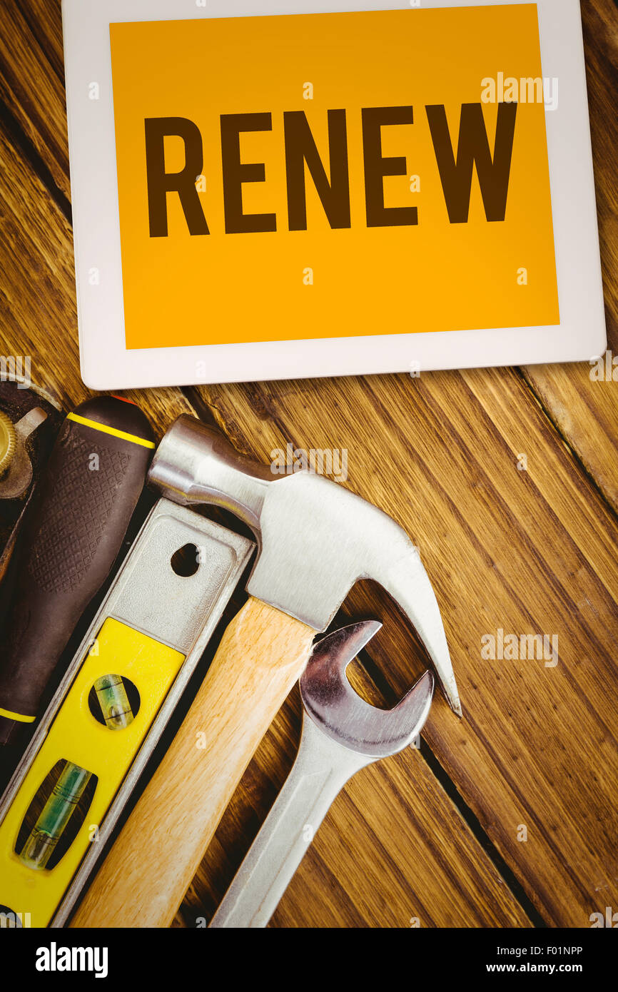 Renew against desk with tools Stock Photo