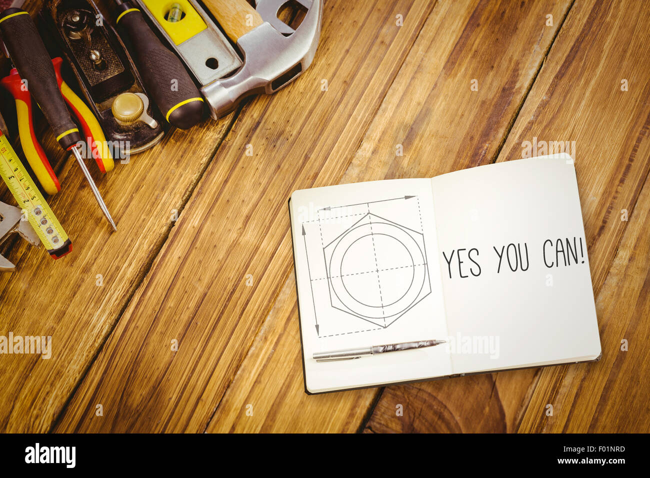 Yes you can! against blueprint Stock Photo