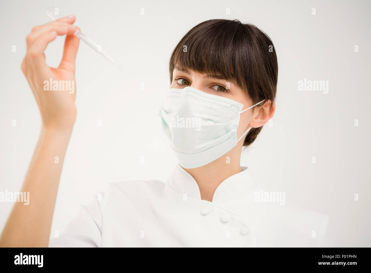 Wearing mask working young hi-res stock photography and images - Alamy